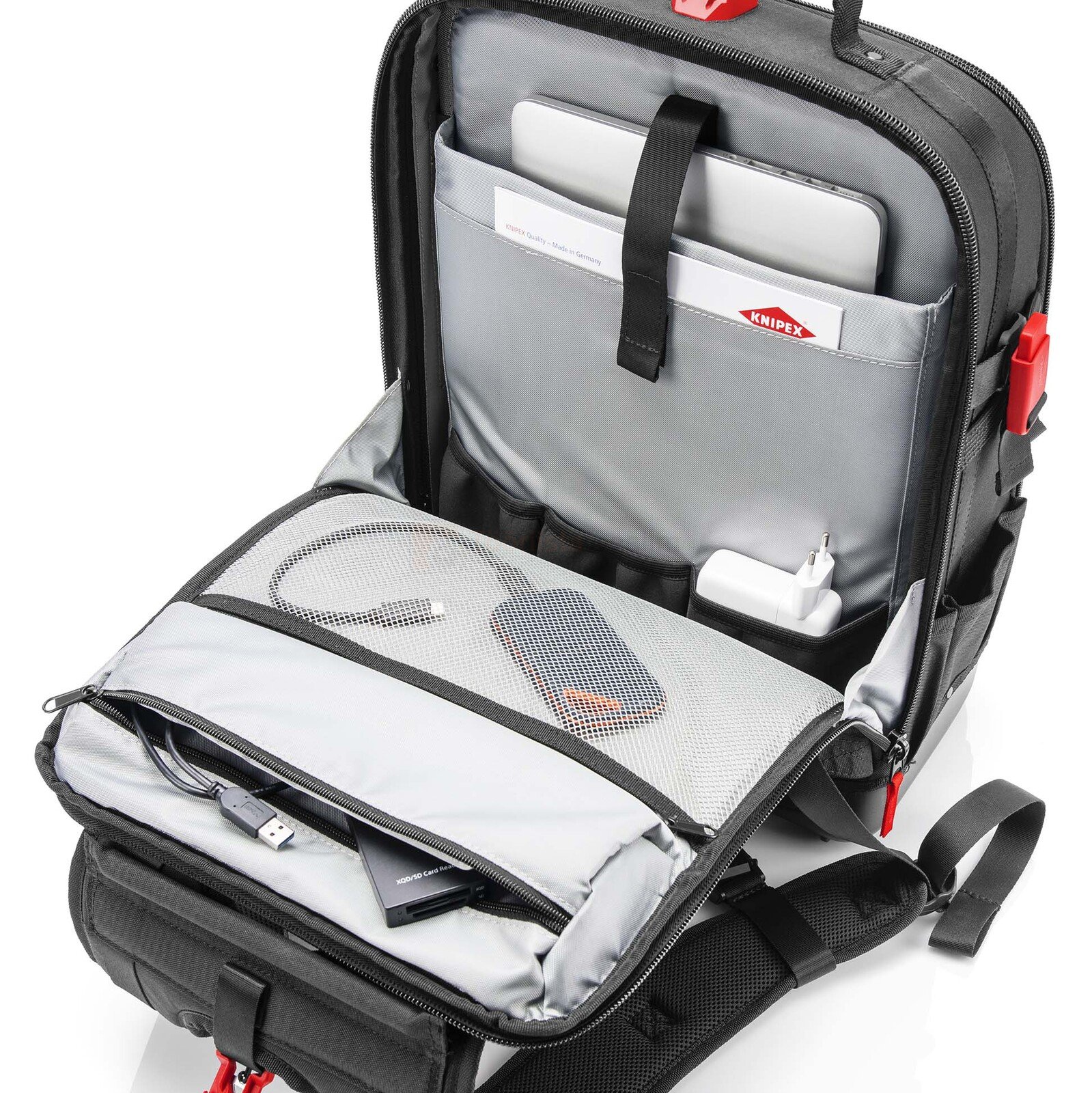 Pildil on avatud Knipex Modular X18 tühi seljakott, mis näitab erinevaid sektsioone ja taskuid sülearvutile...