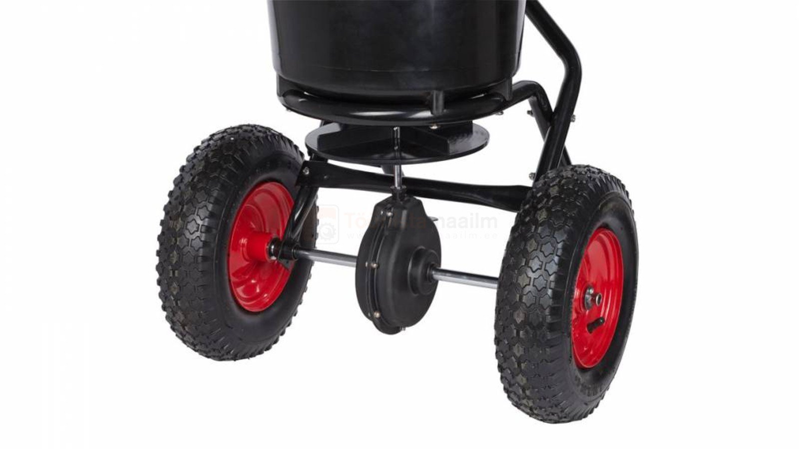 Pildil on näha Kreator 23 L külvikut/laoturit, millel on must anum, punaste ratastega rattad ja mehhanism, mis reguleerib...