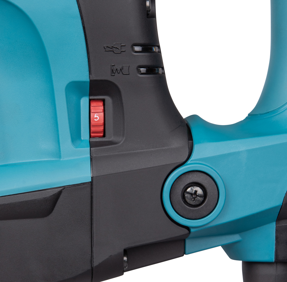 Pildil on detailid Makita piikvasar HM1213C SDS-MAX-i küljelt, näidates seadistuslülitit, mis on seatud numbrile "5" ja...
