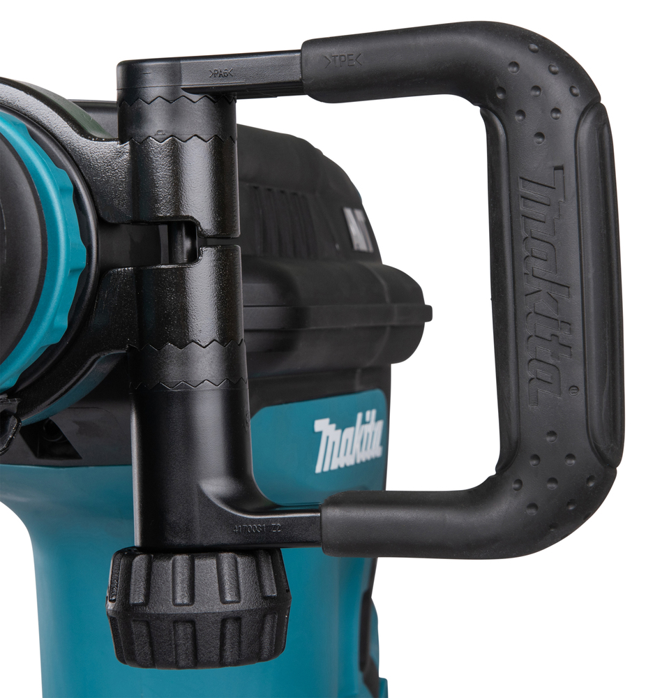 Pildil on detailne vaade Makita piikvasara HM1213C SDS-MAX käepidemest ja selle ühendusest tööriistaga.