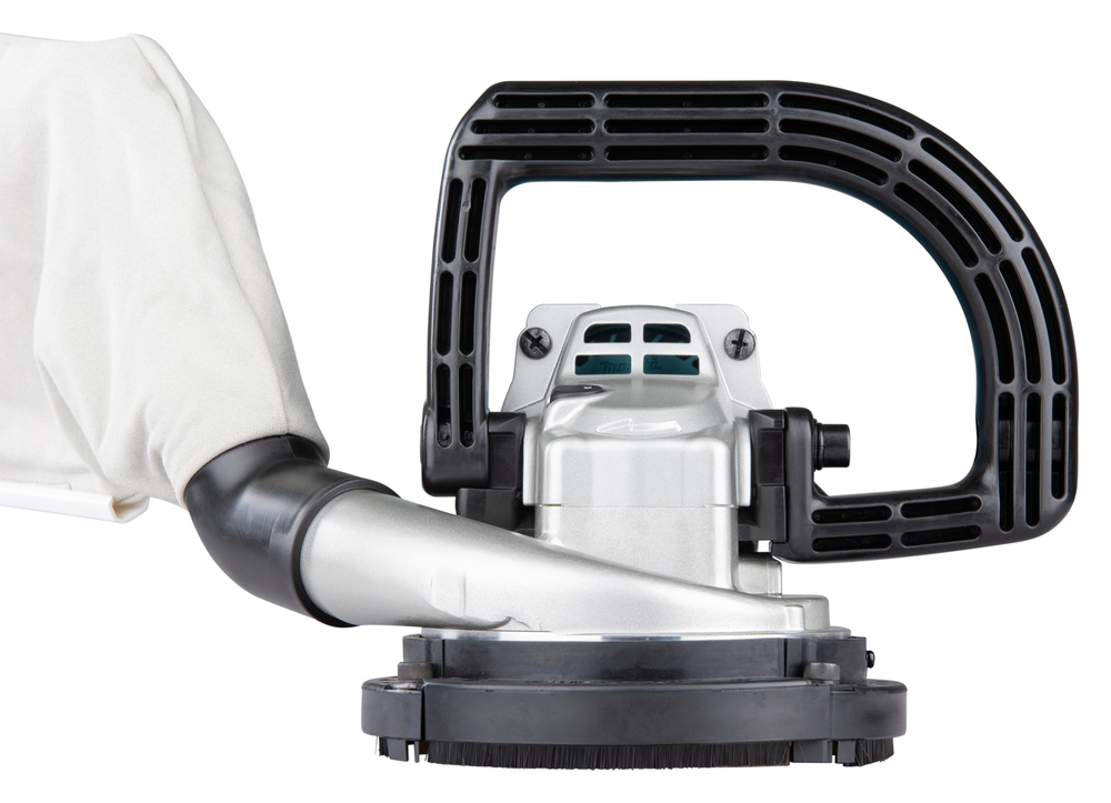 Pildil on Makita betoonilihvmasin NPC5000C, millel on suur käepide ja tolmukogumiskott.