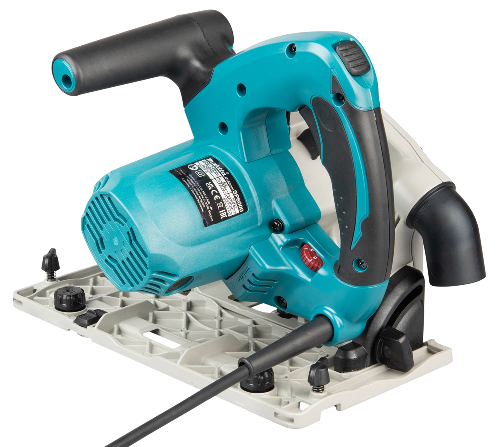 Pildil on Makita ketassaag SP6000J, mis on pealtvaates näha, millel on sinakasroheline korpus, mustad käepidemed ja hall...