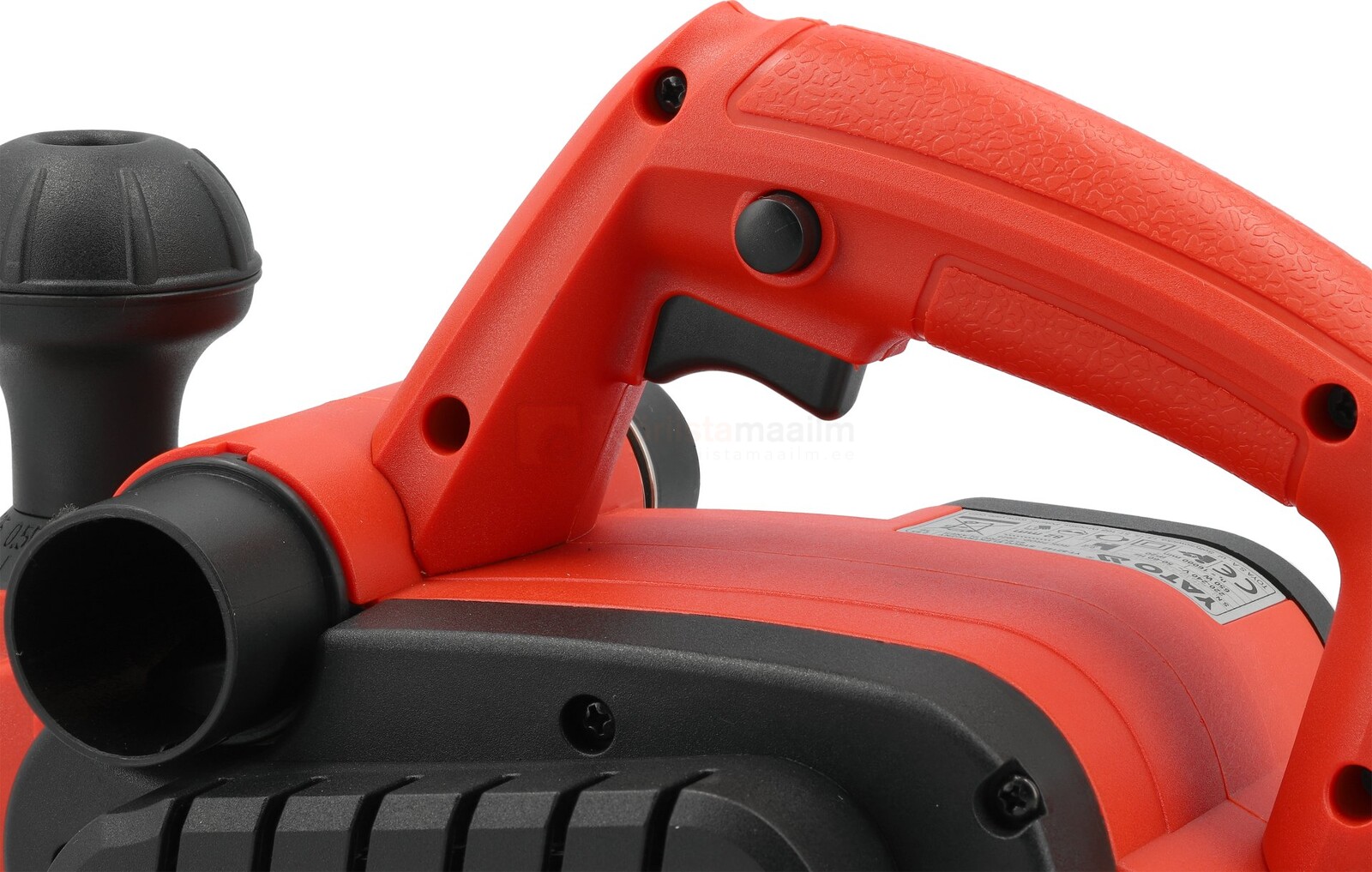 Pildil on näha Yato 650 W elektrilise höövli detailid, sealhulgas oranž käepide päästikuga, must tolmukoguja ja tööriista...