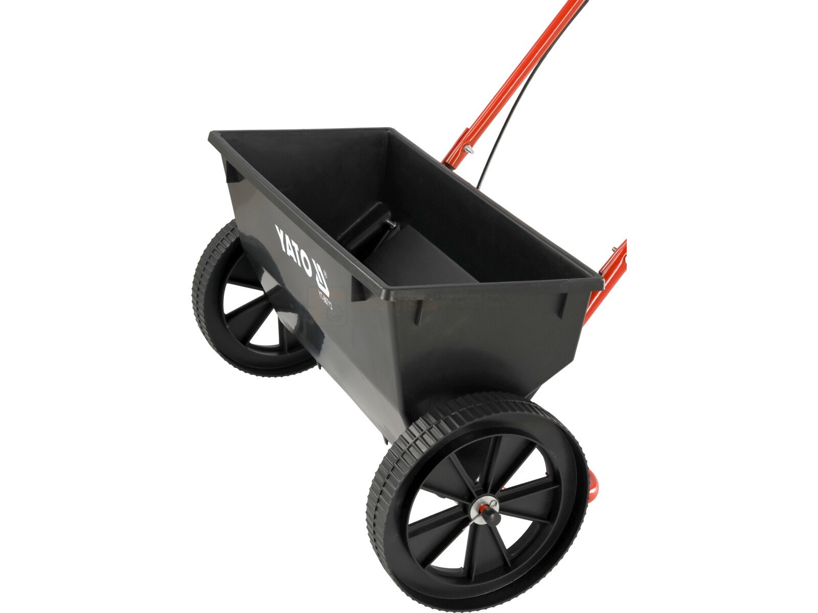 Pildil on musta mahutiga YATO külvik, millel on kaks ratast ja punane käepide.