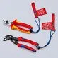 Pildil on kolm Knipex adapter-tööriistarihma, mille külge on kinnitatud erinevat tüüpi tööriistad.