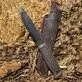Pildil on Morakniv Garberg Grand matkanuga BlackBlade™ koos nahast vutlariga, mis on asetatud õlgedele.