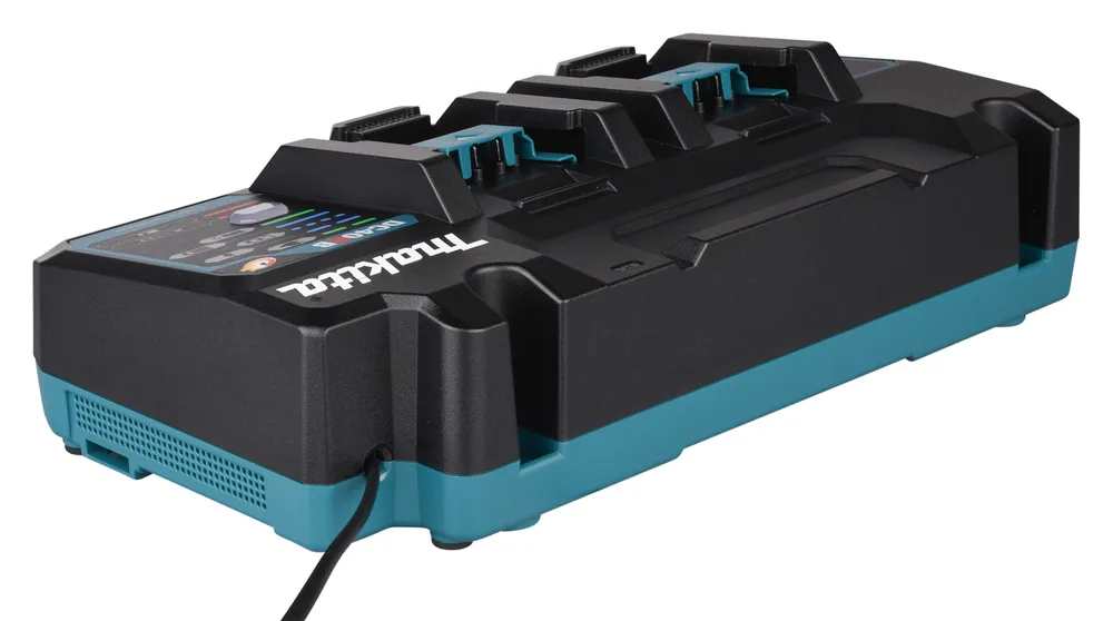 Pildil on Makita akulaadija XGT DC40RB, mis on musta ja türkiissinise värviga ning millel on mitu laadimiskohta ja näha...