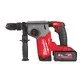 Pildil on Milwaukee M18 FHX-552X akupuurvasar, millel on küljes aku ja lisakäepide.