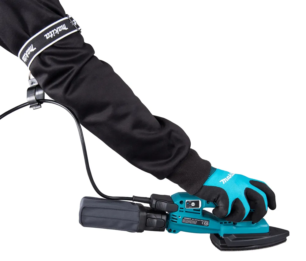 Pildil on kujutatud Makita akutaldlihvija BO006CGZ, millel on näha tolmukogumisava ja "XGT" logo.