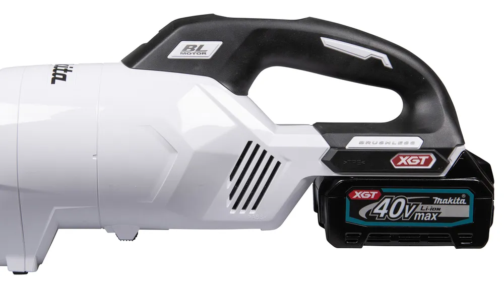 Pildil on Makita akuvarstolmuimeja CL003GD203, millel on näha aku, juhtpaneel ja valgusti.