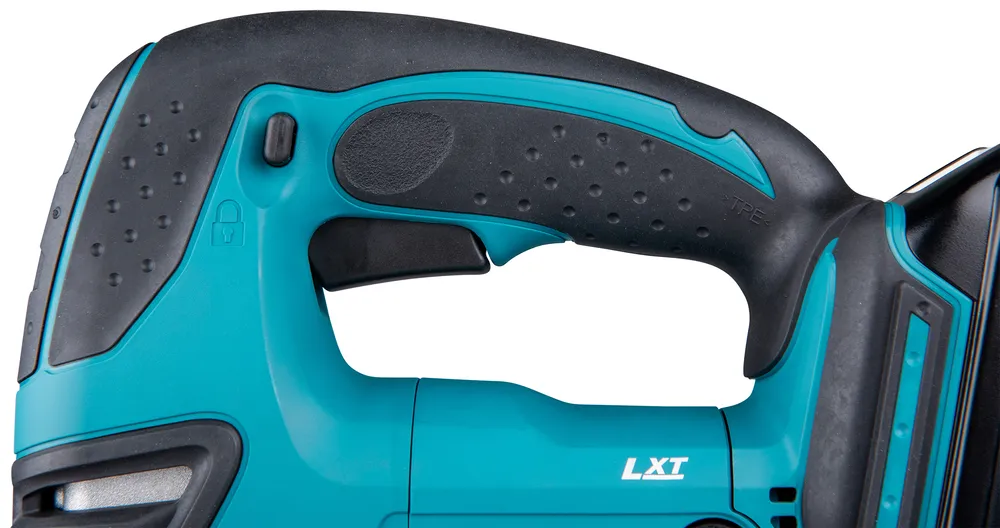 Pildil on Makita akutikksaag DJV180Z, kus on näha käepide ja selle detailid, nagu lukustusnupp ja TPE-märgistus.