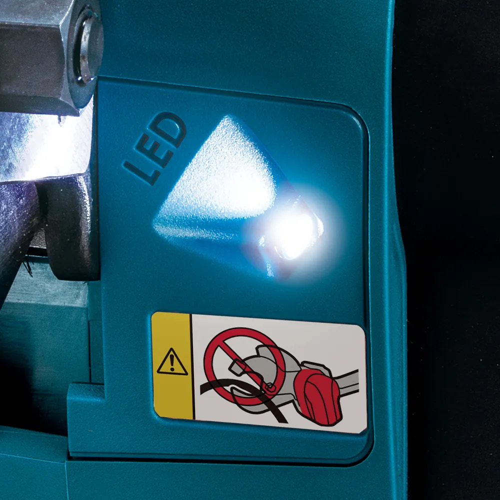Pildil on näha Makita akukaablilõikuri DTC101ZK detail, millel on erk LED-tuli ja hoiatusmärgis.