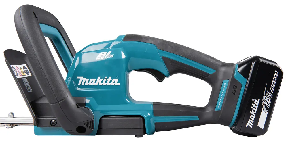 Pildil on Makita akuhekilõikur DUH606RT, millel on roheline korpus, mustad käepidemed, lõiketerad ja aku.