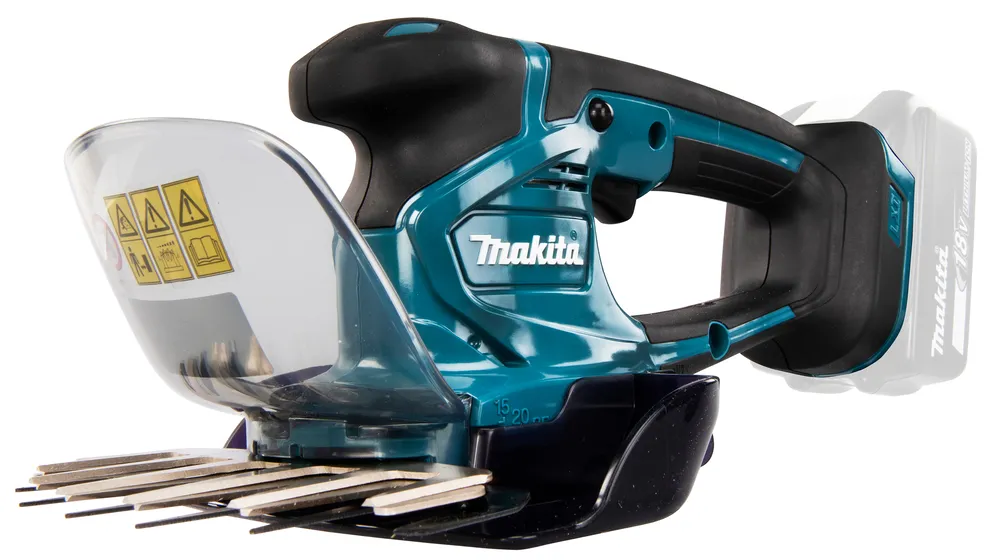 Pildil on kujutatud Makita akuga murukäärid DUM604ZX, millel on selgelt näha kaitsesirm koos ohutusmärkidega, tera ning...