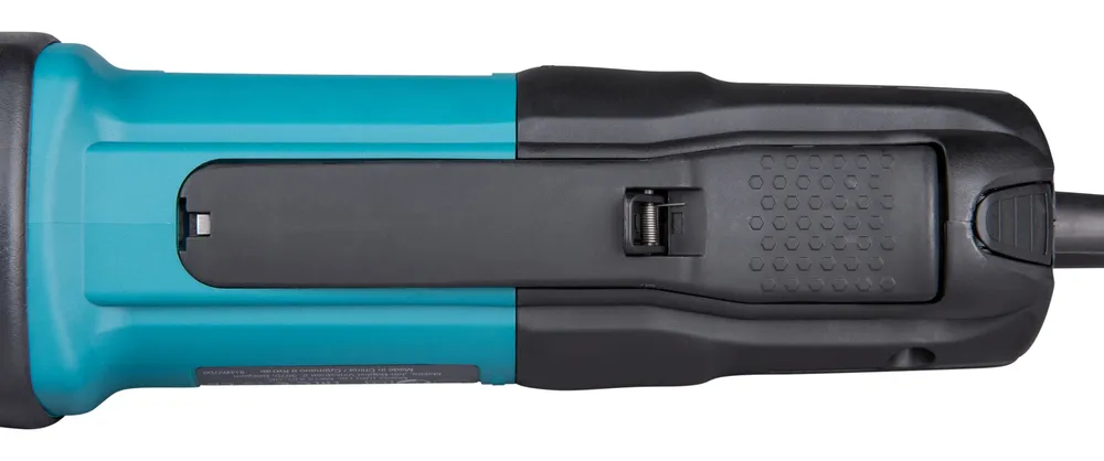 Pildil on Makita otslihvija GD0600 korpus, millel on näha lüliti, nupud ja aku pesa.