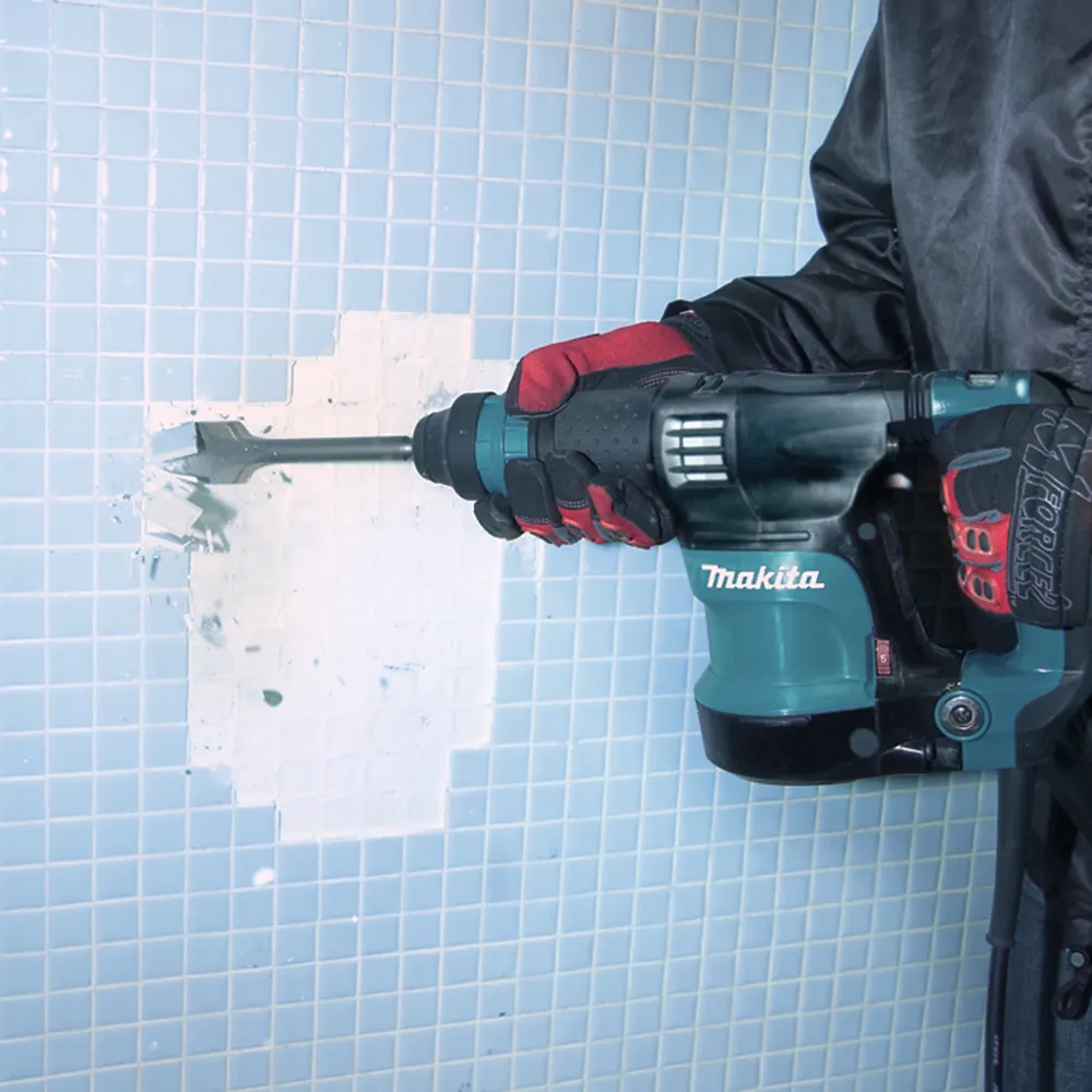 Pildil on Makita piikvasar HK1820 SDS-Plus, mida kasutatakse seinaplaatide eemaldamiseks.