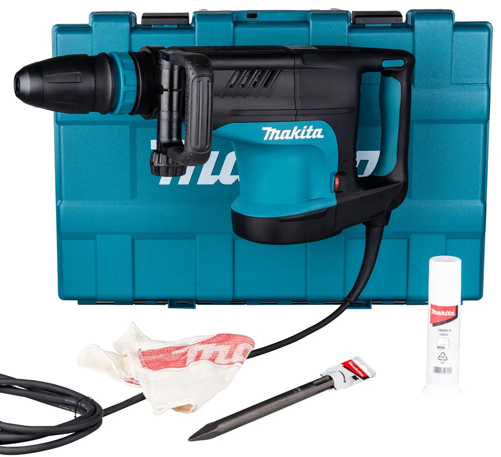 Pildil on Makita piikvasar HM1203C koos kohvriga, tarvikutega nagu piik, puhastuslapp ja määrdeõli.