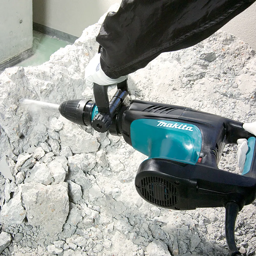 Pildil on Makita piikvasar HM1203C, mida kasutatakse betooni lõhkumiseks.