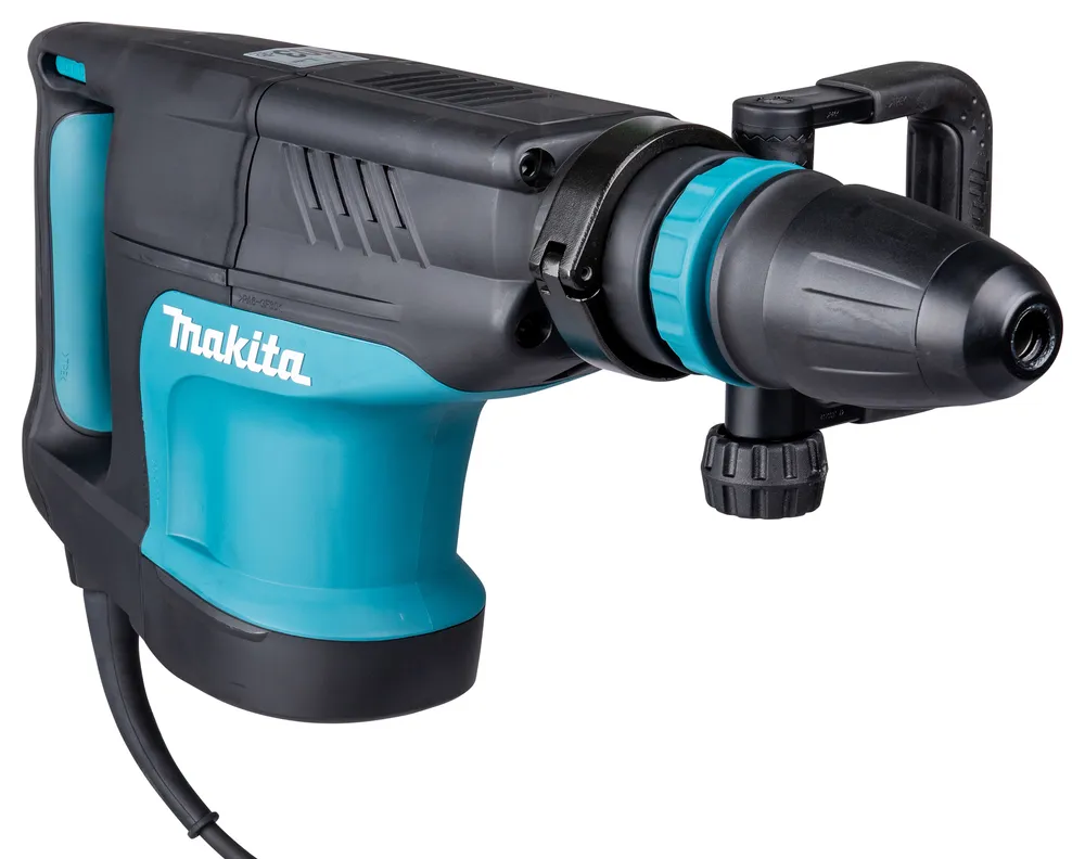 Pildil on Makita piikvasar HM1203C, millelt on näha tööriista keha, käepide ja terav ots.