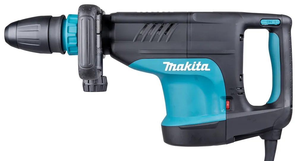 Pildil on Makita piikvasar HM1203C, millel on sinine korpus ja mustad detailid ning on näha sisse-väljalülitusnuppu.
