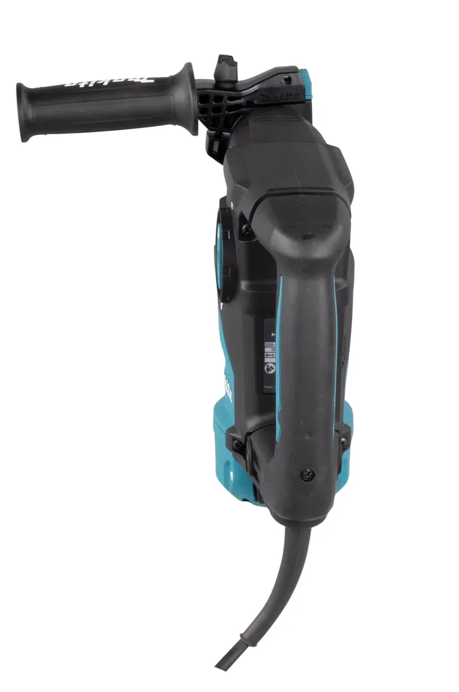 Pildil on näha Makita kombivasar HR3012FCJ, mis on tagurpidi keeratud ja mille toitejuhe ripub all.