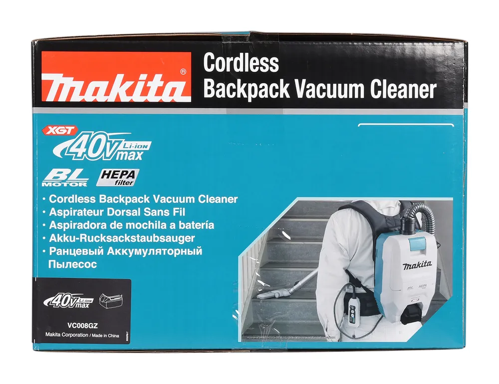 Pildil on Makita VC008GZ akutolmuimeja karp, millel on kiri "Cordless Backpack Vacuum Cleaner" ja pilt seljakotitolmuimejast.