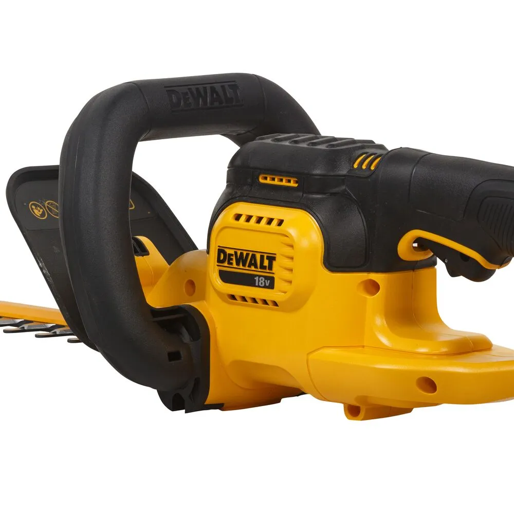 Pildil on DeWalt akuhekipügaja DCM563PB, millel on kollane ja must värvilahendus ning mis näitab seadme ülaosa ja käepidet.