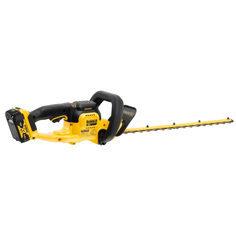 Pildil on DeWalt akuhekipügaja DCMHT563P1, mis on nähtav küljelt, koos aku ja lõiketeraga.