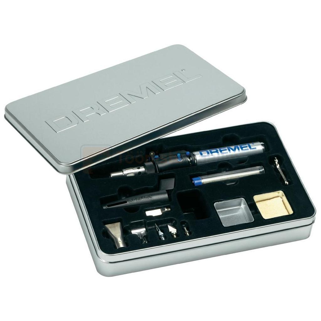 Pildil on avatud metallkarbis Dremel Versatip jootekolb koos erinevate otsikute ja tarvikutega.